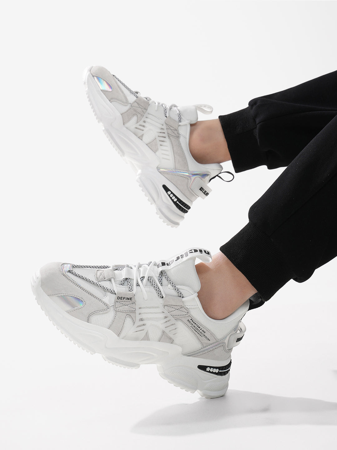 Model wearing Phantom A-500 Snow Phantom – Casual white shoes styled for urban look